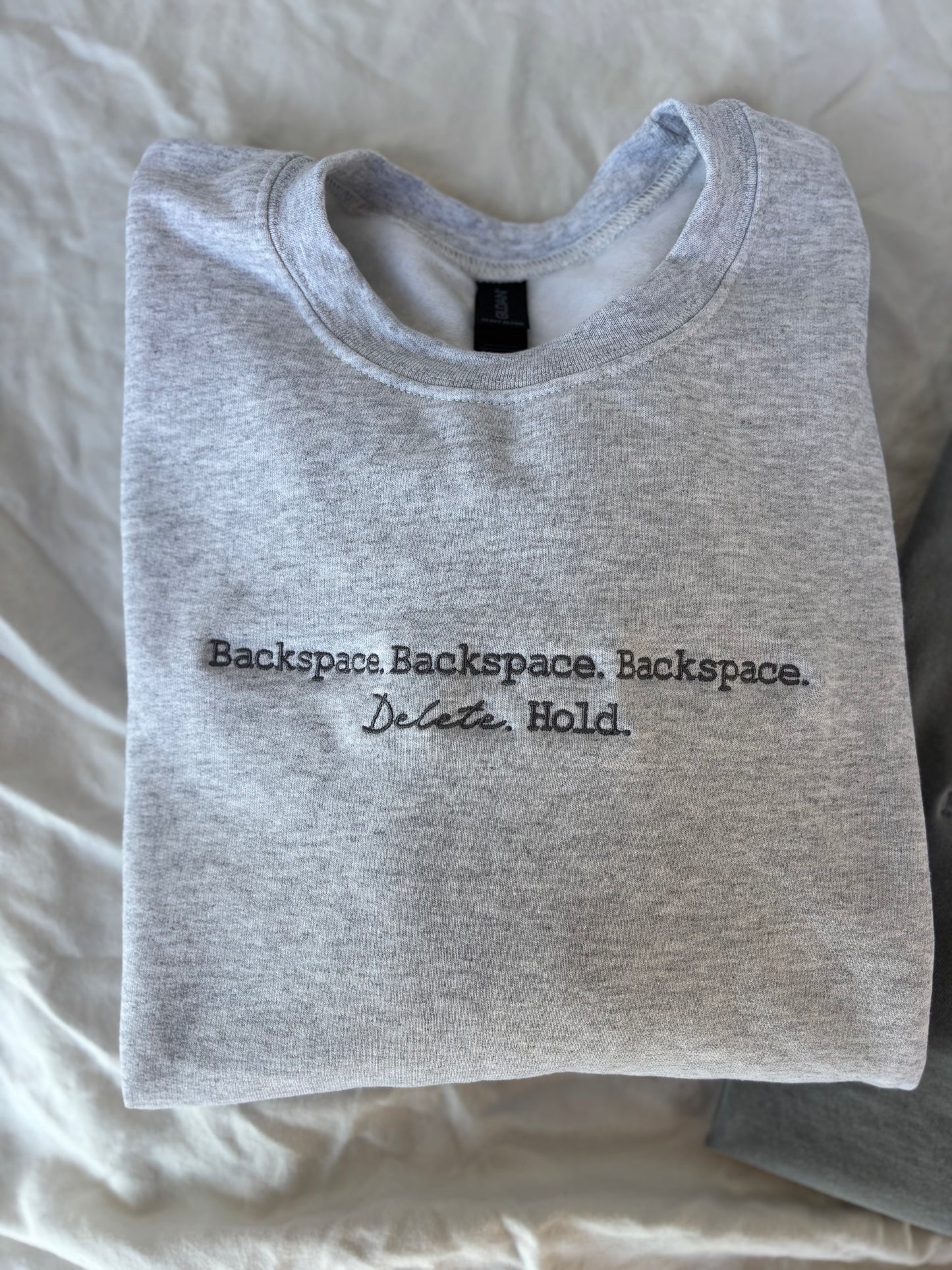 'Backspace.' Embroidered Design - Multiple Options (LICENSED Ravenhood® Legacy Collection)